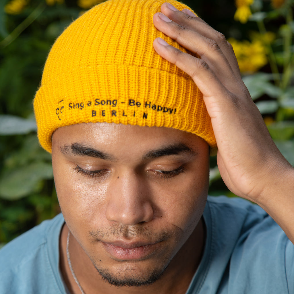 Sing a Song – Be Happy! Beanie Goldgelb